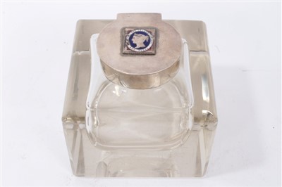 Lot 959 - Silver and glass inkwell with enamelled stamp to lid