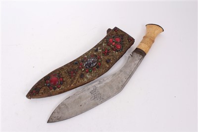 Lot 846 - Indian Kukri with bone hilt, in ornate filigree work sheath, set with glass beads and semi precious stones, 43cm in overall length.