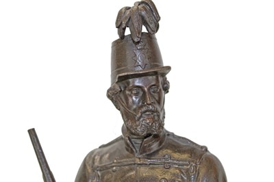 Lot 3617 - Victorian spelter figure of a soldier in the Rifle Volunteers, mounted on a turned wooden plinth, together with a pair of brass military figures. (3)