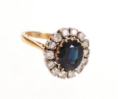 Lot 489 - Sapphire and diamond cluster ring