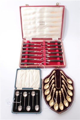 Lot 338 - Set 12 Victorian silver gilt Egyptian Revival teaspoons and tongs, George Angel, London 1873. Together with a Harrods fruit cutlery boxed and six coffee spoons