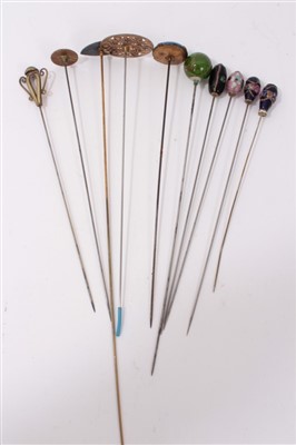 Lot 3371 - Group of eleven Edwardian and later enamel and glass mounted hatpins