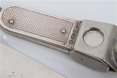 Lot 3656 - Edwardian Asprey & Co silver cigar cutter (London 1910), 14cm long, together with another with engine turned decoration (2)