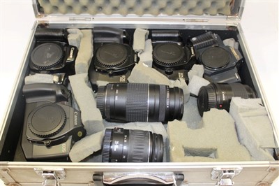 Lot 137 - Five Canon 35mm SLR cameras comprising EOS 600, 650, 1000F and 5000 models, a T70 and three Canon 200mm lenses