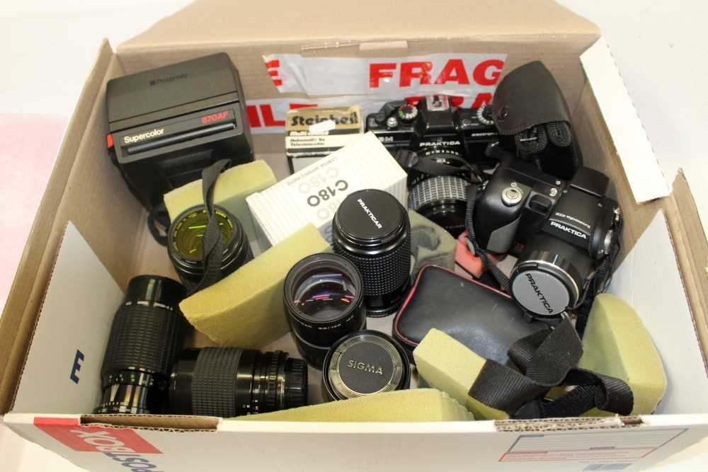 Lot 151 - Quantity of cameras, lenses and related items including a Praktica BM camera, various Praktica and Sigma lenses, a Polaroid 670AF and other items