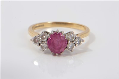 Lot 3357 - 18ct gold diamond and pink stone ring with an oval cut pink tourmaline/ruby flanked by six brilliant cut diamonds in claw setting on 18ct gold shank