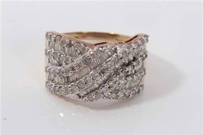Lot 3383 - Ladies 9ct gold diamond dress ring in cross-over setting