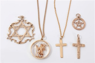 Lot 3391 - Two 9ct gold Star of David pendants, 9ct gold St Christopher pendant, two 9ct gold cruciform pendants and two yellow metal chains