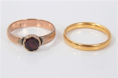 Lot 3397 - 22ct gold wedding ring and an antique rose gold ring set with as single garnet (2)