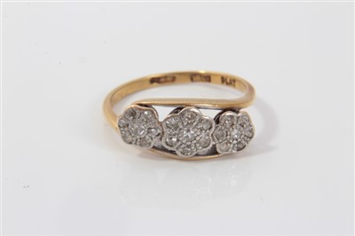 Lot 3399 - 1930s 18ct gold and diamond ring, the triple daisy head setting mounted with diamonds