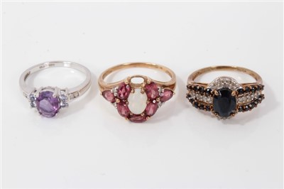 Lot 3401 - Two 9ct gold gem set dress rings, together with another similar in white gold setting (3)