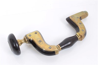 Lot 3729 - Woodworking tools Charles Atkinson Victorian brass and ebony brace, with manufacturer's marks.