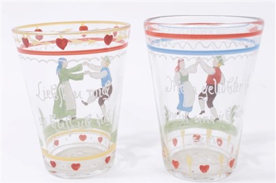 Lot 78 - Two antique European glass tumblers with enamelled decoration and sentiments, 20cmm and 20.5cm