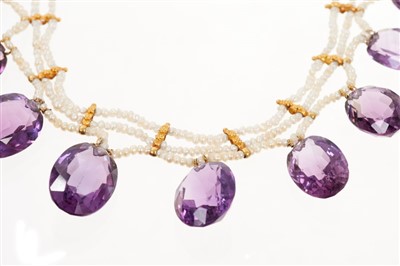 Lot 434 - Mid 19th century amethyst and seed pearl necklace comprising swags of seed pearls and wired amethyst drops strung with high carat gold spacers, circa 1850