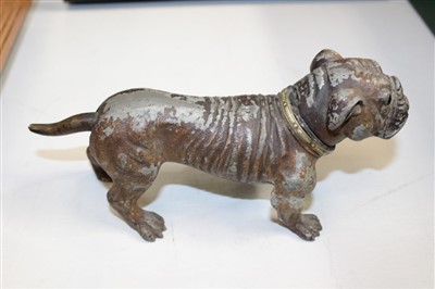 Lot 3726 - An amusing vintage novelty cold painted spelter lighter in the form of a bulldog, the lighter concealed by the hinged dog’s head operated by the tail. 20cm