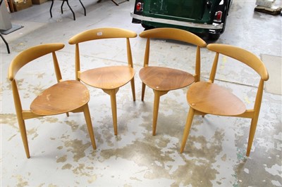 Lot 3772 - Set of four Hans Wegner for Fritz Hansen Danish teak and plywood 'heart' dining chairs with shaped seats, curved back rails and three cylindrical legs