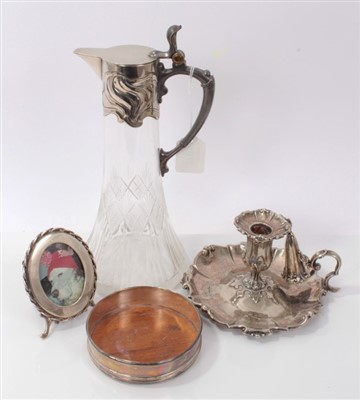 Lot 3707 - Art Nouveau silver plated and cut glass claret jug 27cm, plated chamber candlestick, coaster and photo frame (4)