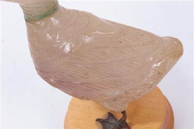 Lot 3710 - Unusual carved hard stone figure of a duck with white metal webbed feet on wooden base 12cm