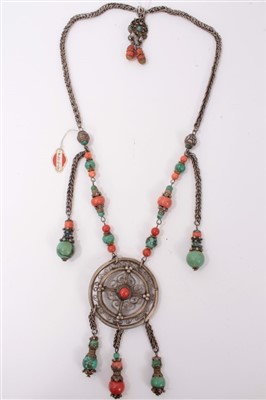 Lot 3406 - Old Chinese coral, turquoise and white metal necklace with a circular disc with pendant drops, suspended from a coral and turquoise bead chain