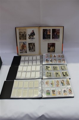 Lot 2519 - Cigarette card selection in albums mostly Players and Wills, large and small cards. Plus an album of Military interest postcards including Bairnsfather, WW1 silks etc.