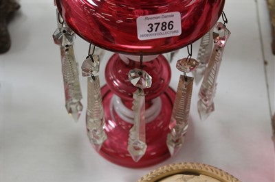 Lot 118 - 19th century ruby glass lustre, with crenellated rim and opaque spiral twist ornament, 55cm high