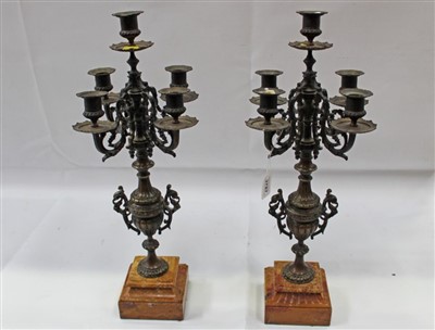 Lot 3787 - Pair of Continental bronze candelabrum, each with five leaf scrolled branches on classical fluted bulbous column and variegated stepped marble base, 55cm high