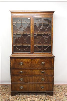 Lot 1416 - George III mahogany two height secretaire bookcase