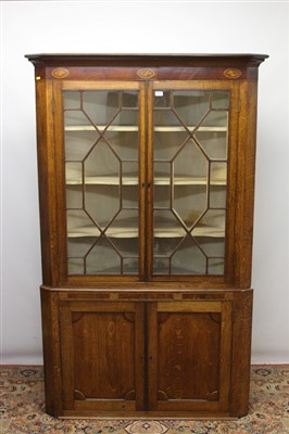 Lot 1415 - George III oak two height corner cupboard with inlaid shell decoration