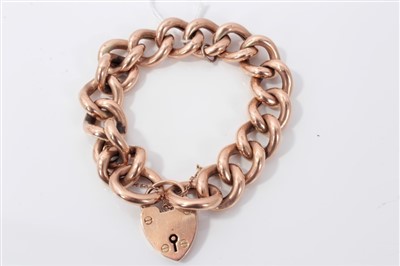 Lot 3426 - Rose gold (9ct) large curb link bracelet with padlock clasp