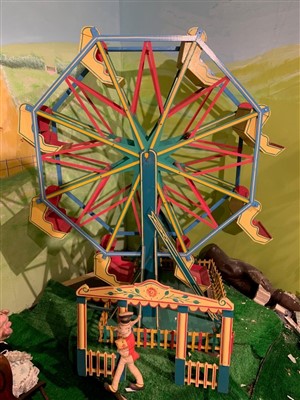 Lot 3805 - Large scratch built painted model of a Ferris wheel with swing seats and picket fence around base.  Height 173cm x width 150cm.