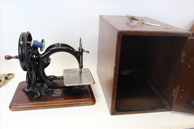 Lot 3578 - Antique sewing machine in mahogany case