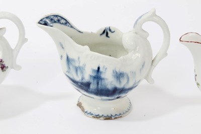 Lot 38 - Three 18th century Derby Dolphin ewer form cream jugs