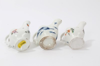 Lot 95 - Three 18th century Derby Dolphin ewer form cream jugs