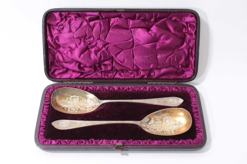 Lot 203 - Pair of Victorian silver serving spoons with engraved bowls in original fitted case