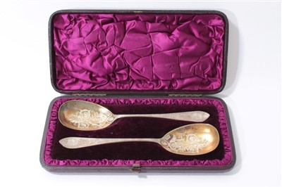 Lot 203 - Pair of Victorian silver serving spoons with engraved bowls in original fitted case