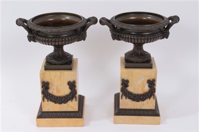 Lot 842 - Pair of 19th century classical revival bronze campana urns on sienna marble plinths