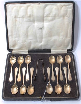 Lot 314 - Set of twelve silver gilt dog-nose teaspoons and matching tongs in fitted case