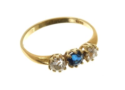 Lot 565 - Gold (18ct) diamond and sapphire three stone ring