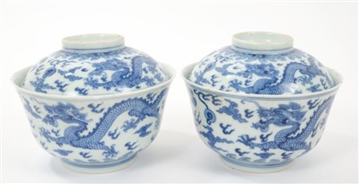 Lot 13 - Pair 19th century Chinese blue and white bowls and covers with continuous five toed dragons chasing pearls amid clouds