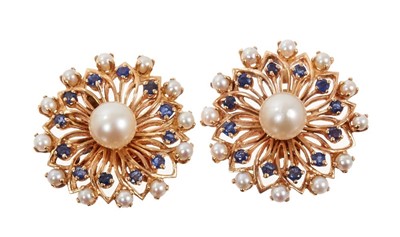 Lot 486 - Pair of cultured pearl and blue sapphire earclips with stylized flower head cluster design, stamped 14k.