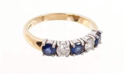 Lot 451 - Diamond and sapphire five stone ring with two round brilliant cut diamonds and two round mixed cut blue sapphire in claw setting on 18ct gold shank. Estimated total diamond weight approximately 0.5...