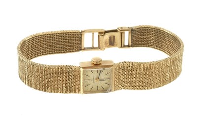 Lot 616 - Lady’s 9ct gold Omega wristwatch on an integral 9ct gold Milanese bracelet.