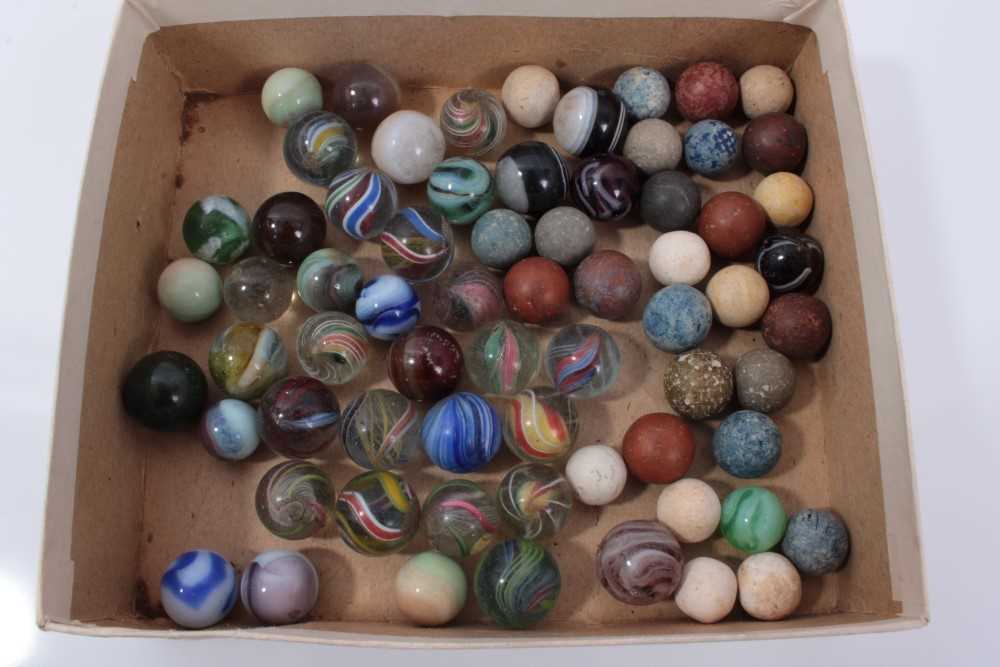Lot 16 - Good collection of Victorian glass and stone marbles, including approximately fifteen polychrome helix and swirl examples, the largest 17mm diameter