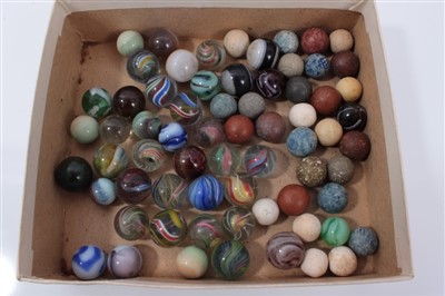 Lot 251 - Good collection of Victorian glass and stone marbles, including approximately fifteen polychrome helix and swirl examples, the largest 17mm diameter