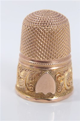 Lot 872 - 19th century gold thimble, with vacant shield shape crest and scroll ornament