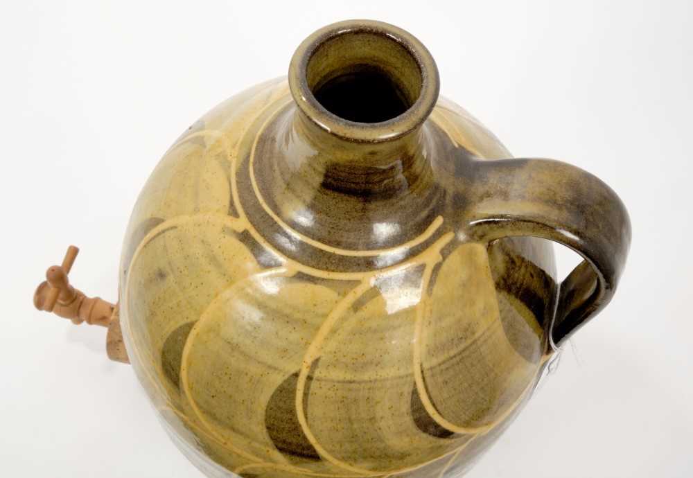 Lot 24 Old pottery cider jar with yellow