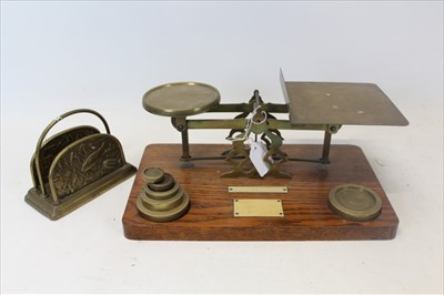 Lot 3575 - Brass letter rack with fish ornament and antique parcel scales on oak base