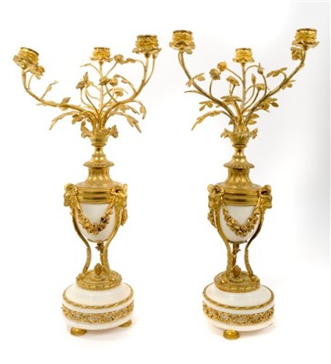 Lot 835 - Impressive pair of Louis XVI style white marble and ormolu mounted three branch candlebra