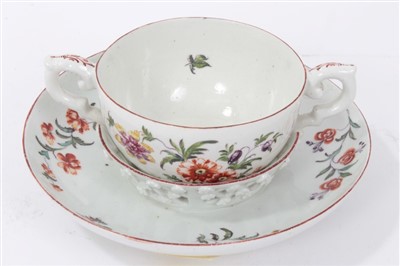 Lot 41 - 18th century Chelsea Derby trembleuse two handled cup and saucer with polychrome painted floral sprays
