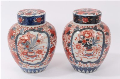 Lot 102 - Pair of Japanese Imari ovoid vases, covers and inner covers